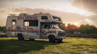 A graffiti-covered motorhome parked in a field, illuminated by the crepuscular rays of the sun partly shrouded by cloud.