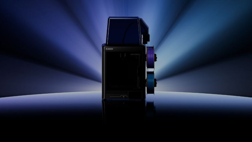 Elegoo Centauri Carbon 2 Combo, cast in shadow with blue light rays behind it