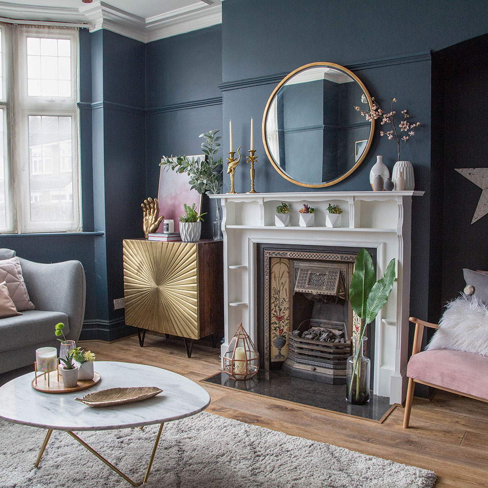 blue living room with white marble fireplace
