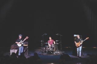 (from left) Scott Henderson, drummer Archibald Ligonniere and bassist Romain Labaye perform at Auditorium Parco della Musica, in Rome on April 11, 2022
