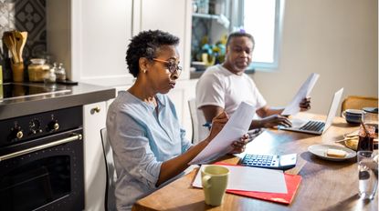 A couple looks at their finances and savings.