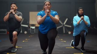 Three people performing lunges