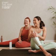 Two women doing a home workout