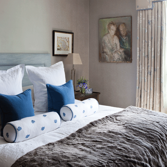 bedroom with bed and blue cushions