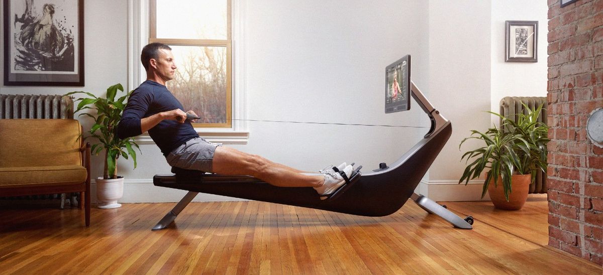 Man using Hydrow rowing machine