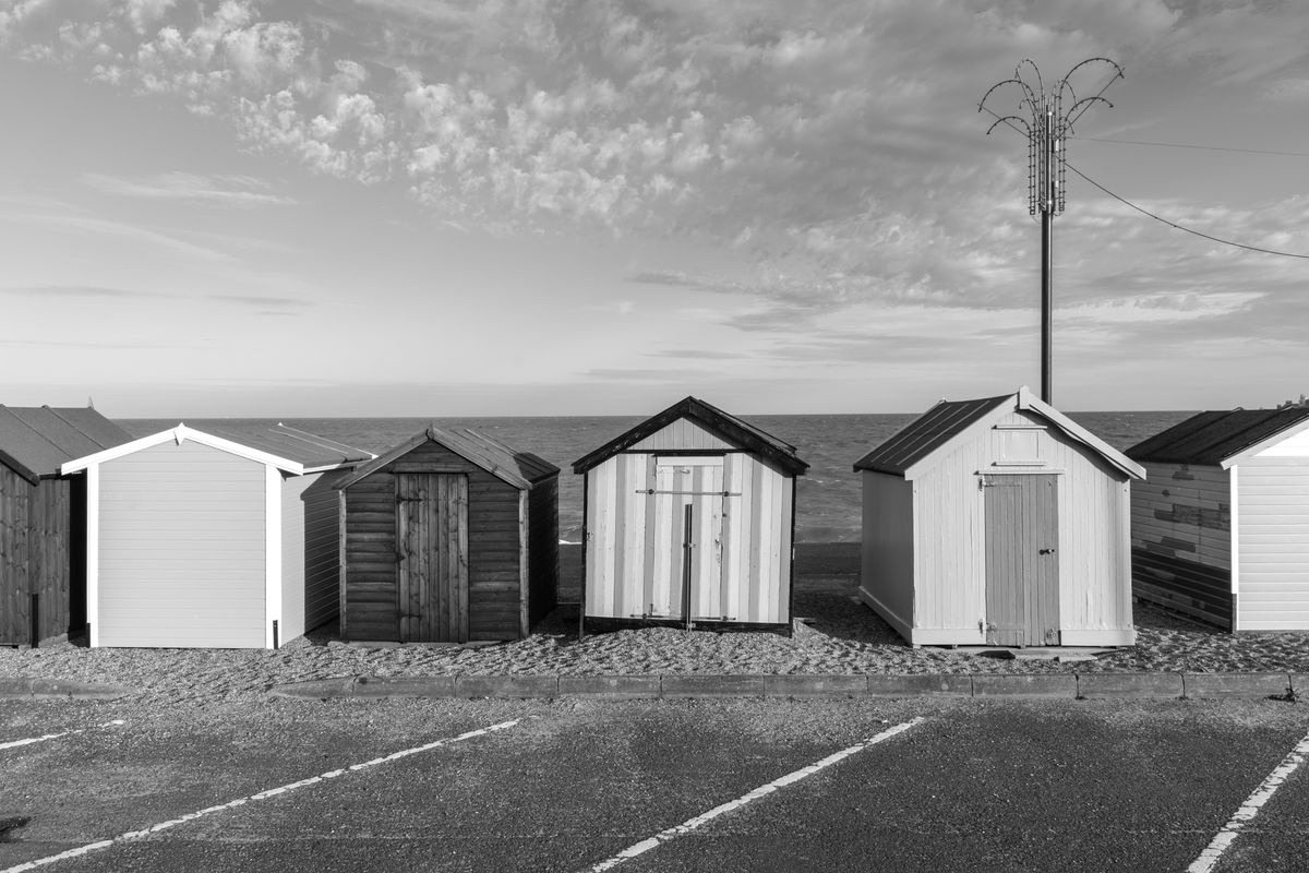 Black &amp; white photo of beach huts taken with the Pentax K-3 Mark III Monochrome