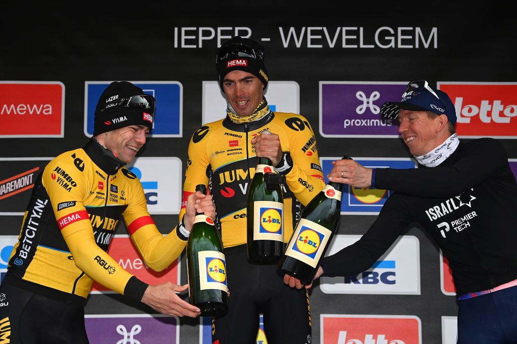 WEVELGEM BELGIUM MARCH 26 LR Wout Van Aert of Belgium and Team JumboVisma on second place race winner Christophe Laporte of France and Team JumboVisma and Sep Vanmarcke of Belgium and Team Israel Premier Tech on third place celebrate on the podium ceremony after the 85th GentWevelgem in Flanders Fields 2023 Mens Elite a 2609km one day race from Ypres to Wevelgem UCIWT on March 26 2023 in Wevelgem Belgium Photo by Tim de WaeleGetty Images