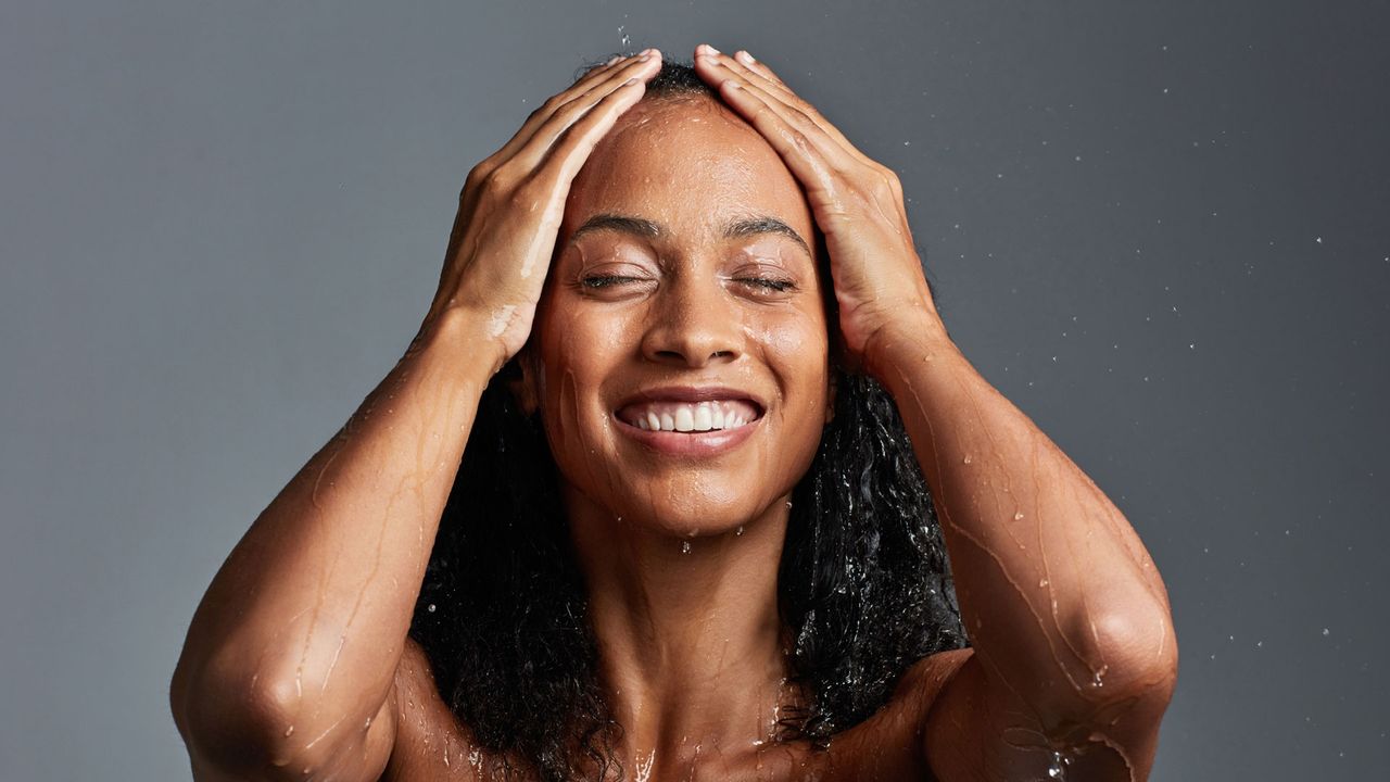 Woman smiling in shower