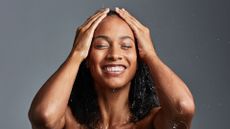 Woman smiling in shower