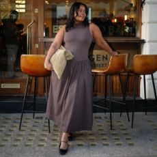 woman wears brown summer dress