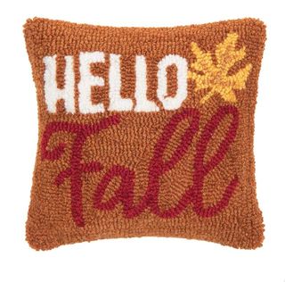 A burnt orange 'Hello Fall' cushion