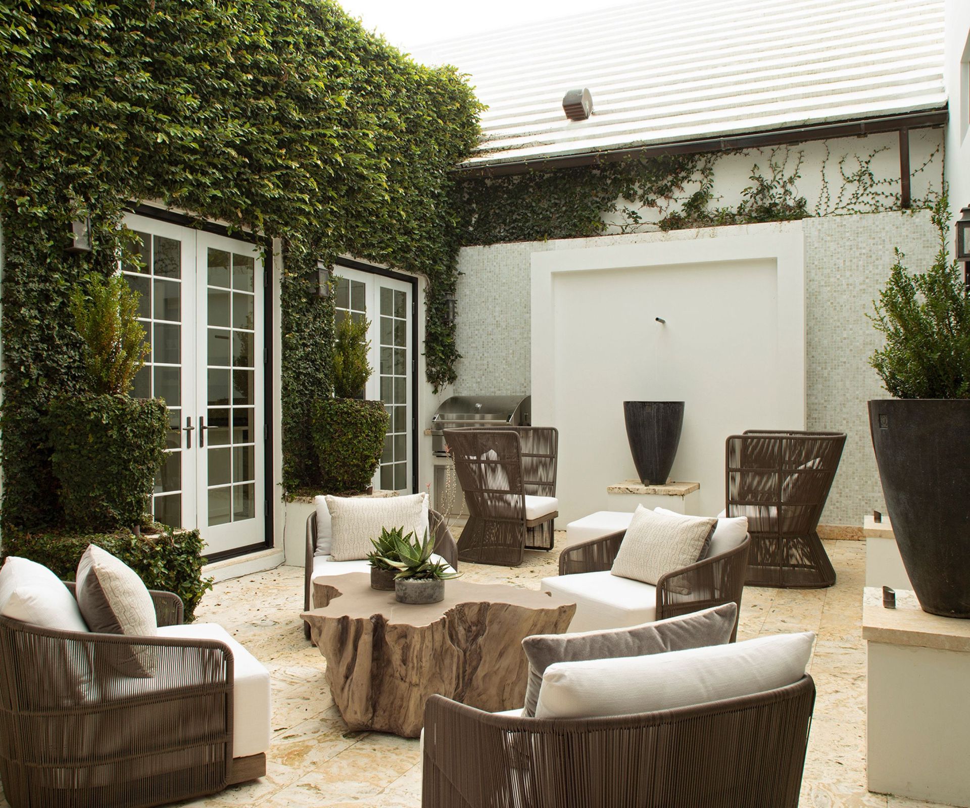 White cushions, wooden table, pot
