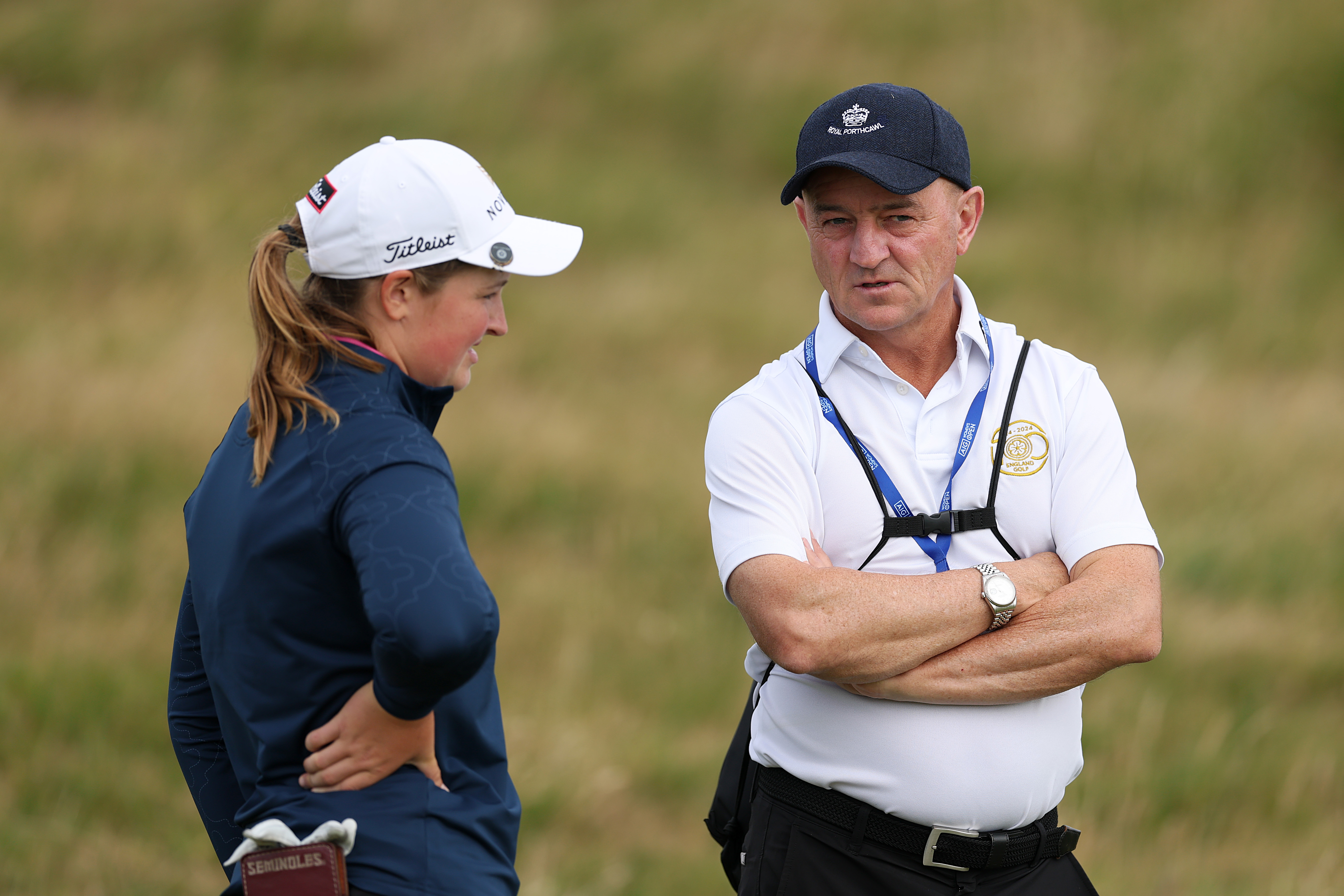 Lottie Woad (left) talks to England Golf performance director Nigel Edwards at the 2025 AIG Women's Open