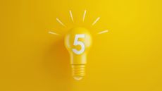 Light Bulb with Number Five on Yellow Background