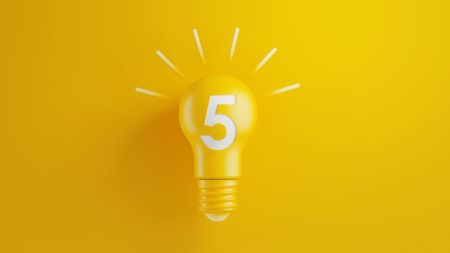 Light Bulb with Number Five on Yellow Background