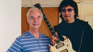 The late John Diggins with Tony Iommi: the Black Sabbath guitarist was one of Diggins' clients