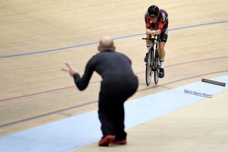 Coach Neal Henderson letting Rohan Dennis know he is on track for the hour record