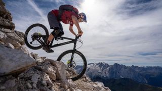 Tom Ohler on a rocky descent in high mountains