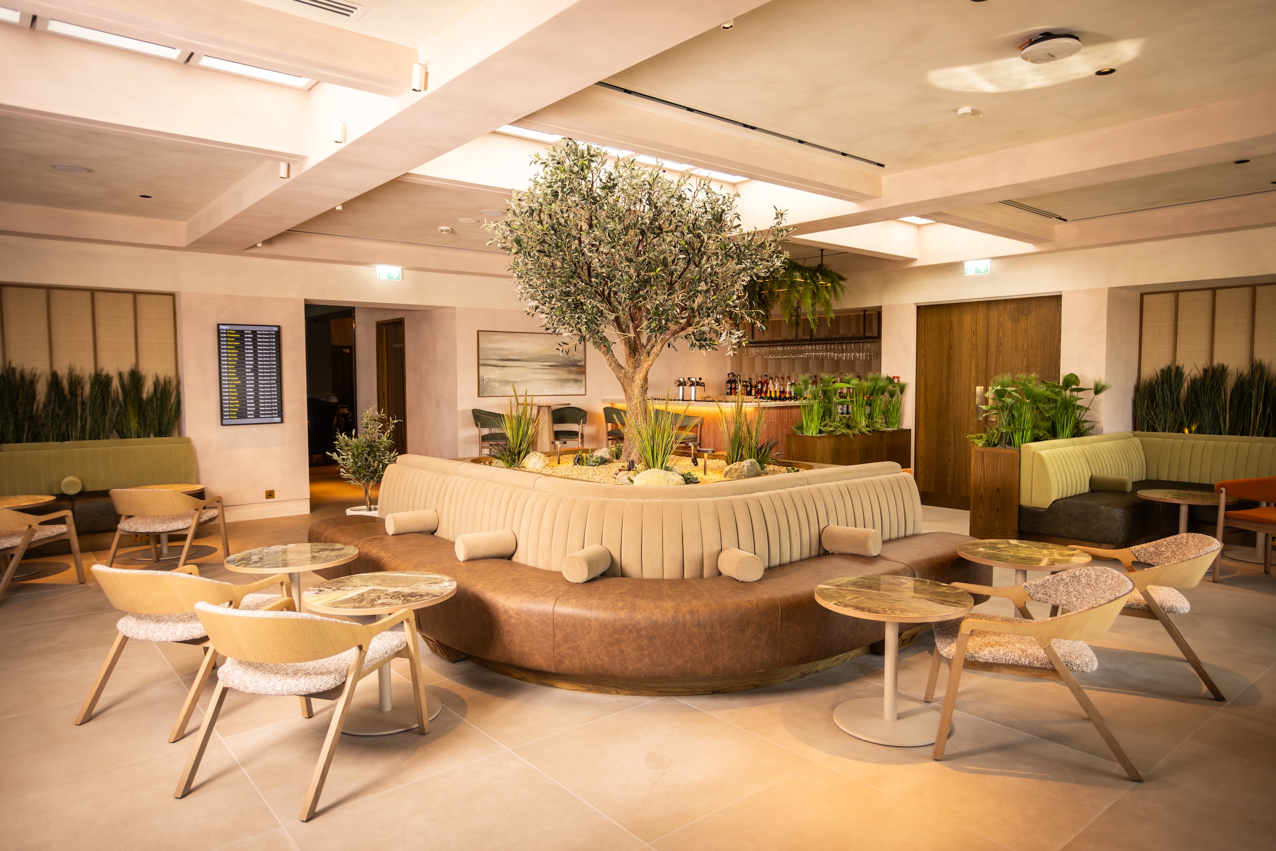Photo of seating areas in the orangery in Clubrooms at Heathrow Terminal 3, an airport lounge by No1 Lounges.
