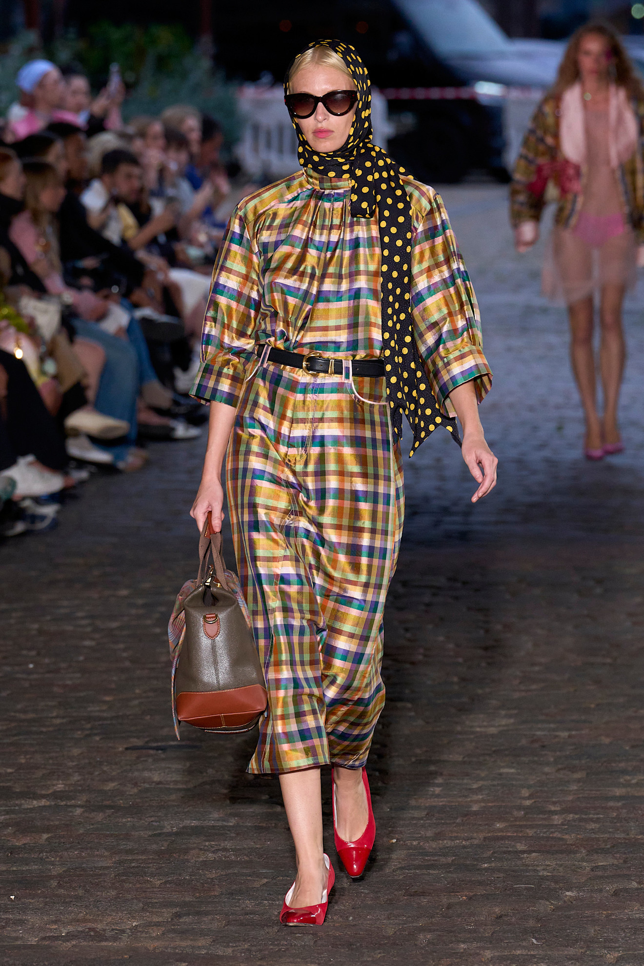 Model wears check tartan print on Caro Editions spring and summer runway