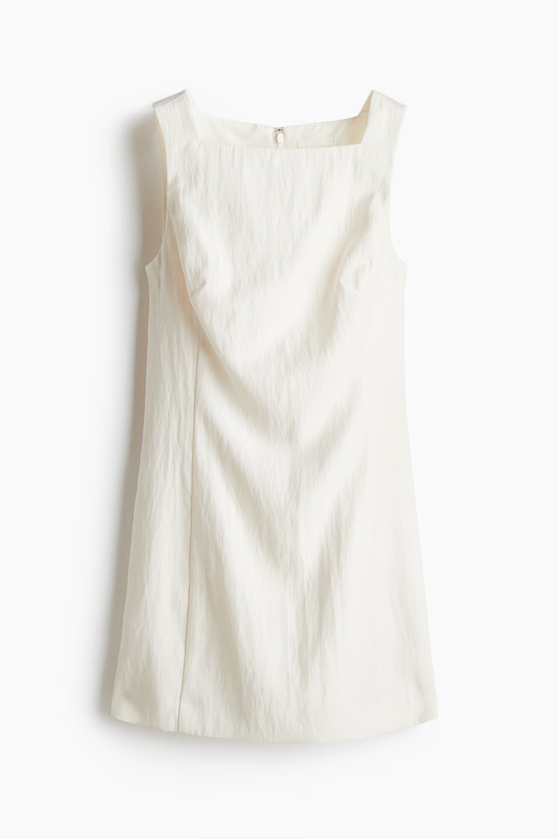 A white H&amp;amp;M mini dress.