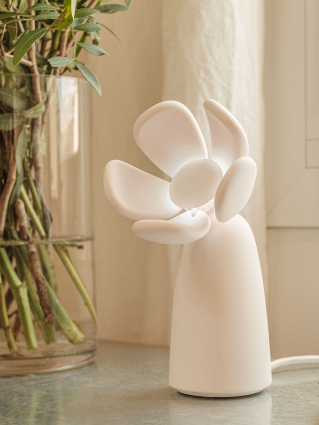 An oat-colored air quality monitor from Bloomie