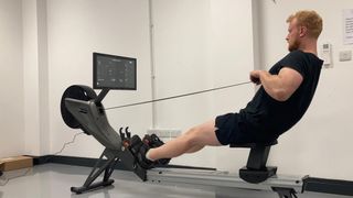Our expert fitness reviewer testing the Aviron Tough Series Rower