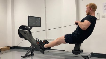 Our expert fitness reviewer testing the Aviron Tough Series Rower