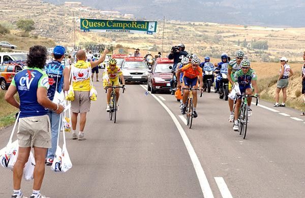 The breakaway group passes through the feed zone