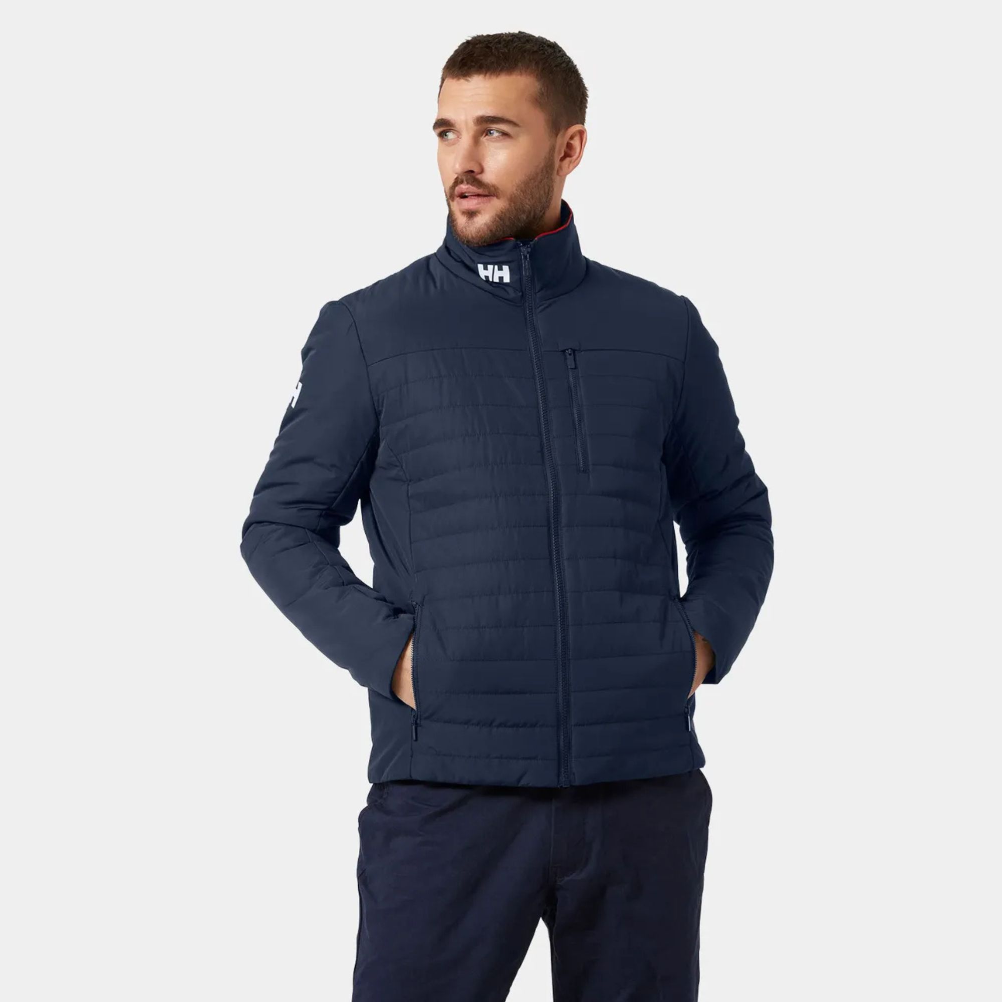 Man wearing a Helly Hansen Men's Crew Insulator Jacket 2.0