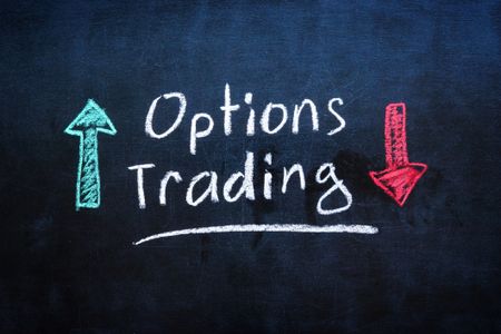 Chalkboard with options trading written in white chalk