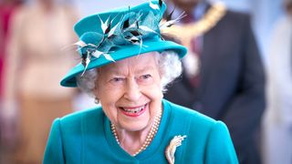 Queen Elizabeth II smiles during a visit to the Edinburgh Climate Change Institute