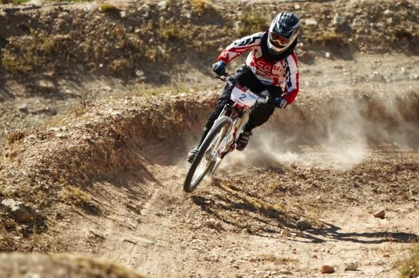 Julia Boer rounds the berm to her 2nd place in the Elite Womens 4X.