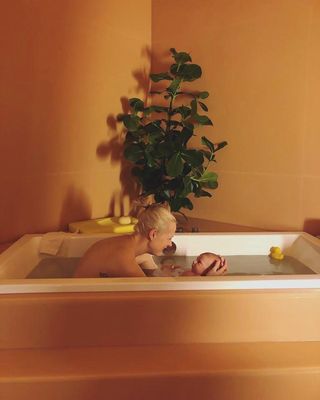 mother and baby in a bath