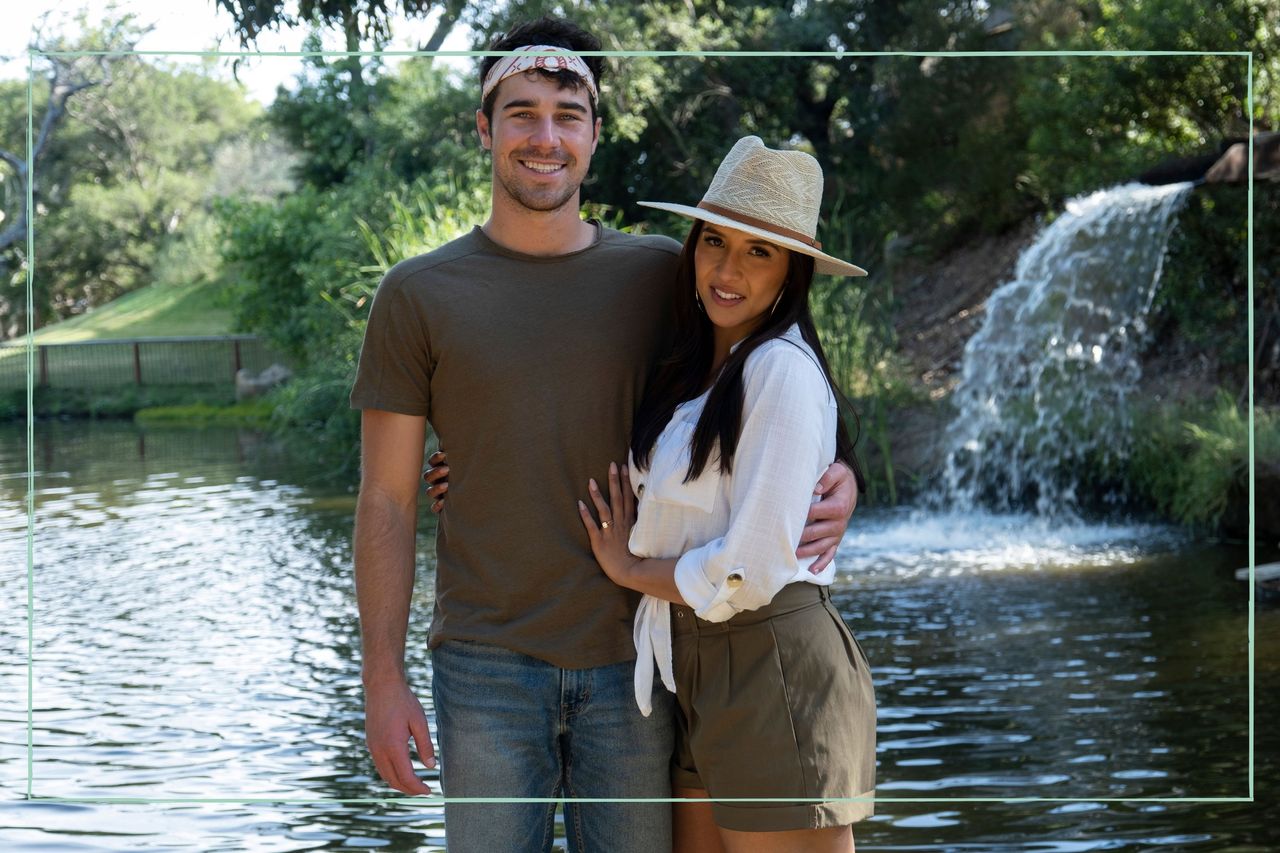 Cole and Zanab posing in front of a waterfall