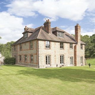 brick and flint house with an elegant look