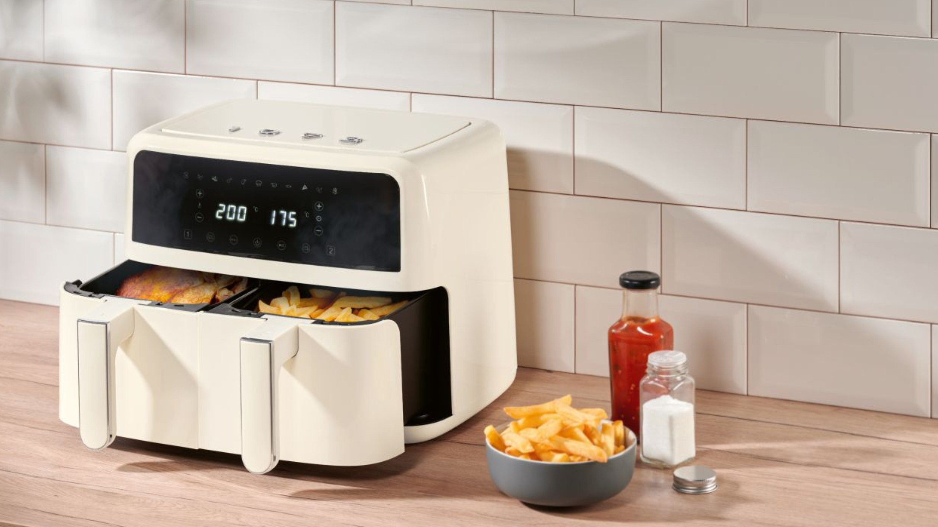 Silvercrest Beige Dual Basket Air Fryer cooking chips on a modern kitchen countertop.