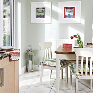 kitchen and dining area with white wall and glass door and dining table and chairs