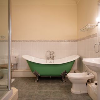 Bathroom with green bathtub