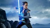 A young woman holding a blue lightsaber