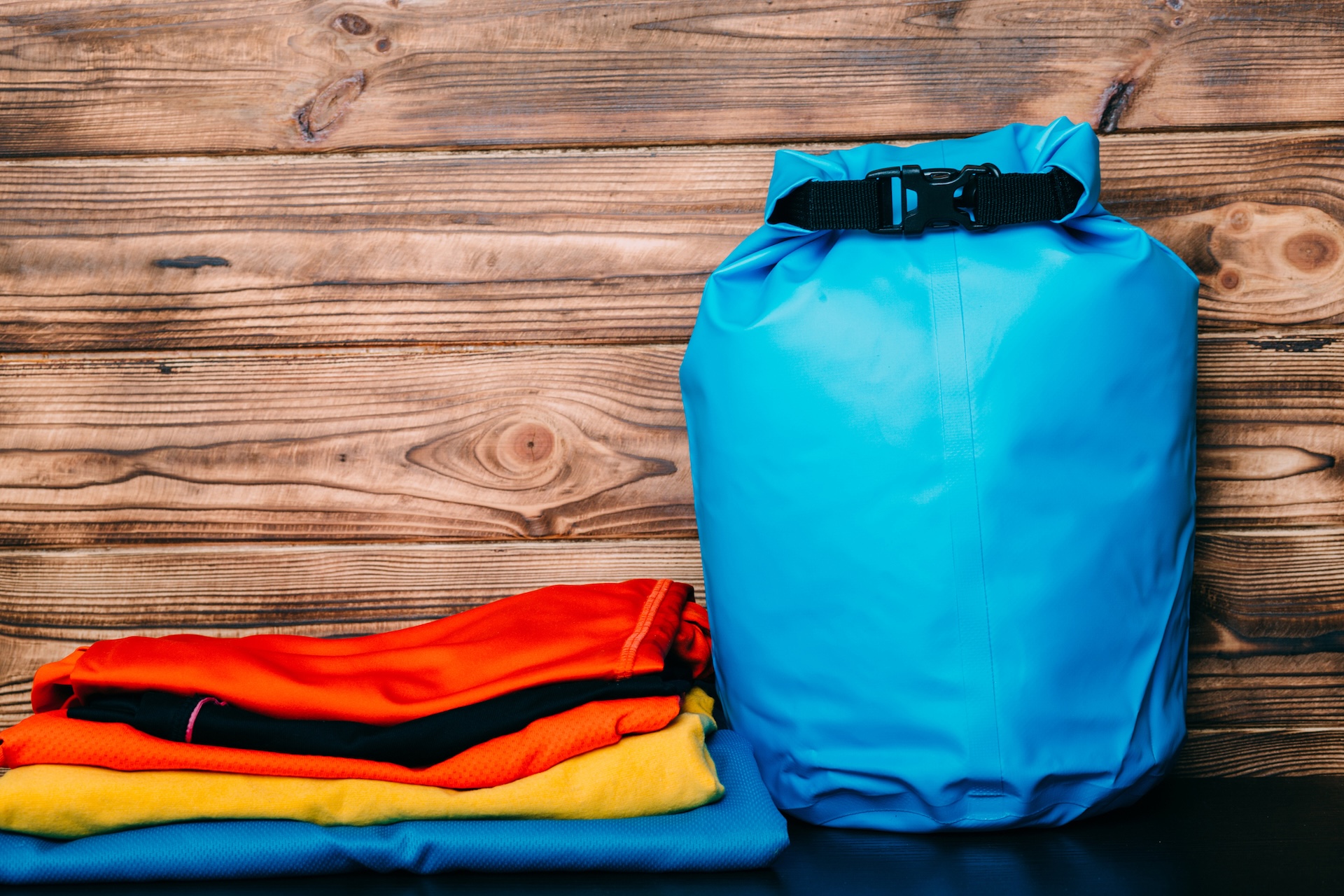 dry bags in different colours are useful for keeping items dry and organized