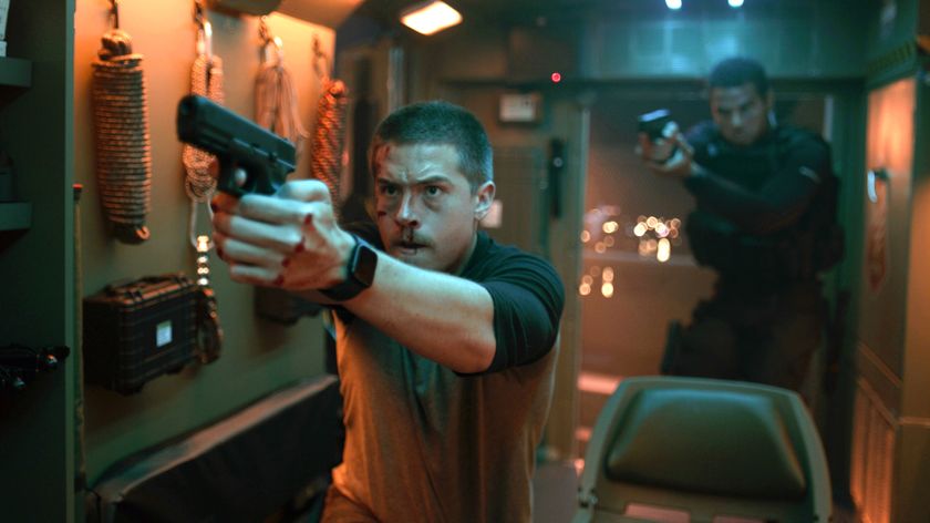 Eric (Dylan Sprouse) (front) and Romeo (Mason Gooding) holding pistols in &quot;Aftermath&quot;