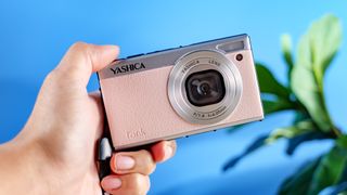 Yashica Tank in pink photographed in front of a blue background