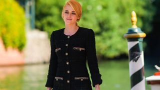 venice, italy september 03 kristen stewart wears a black chanel tweed blazer jacket bodysuit with embroidery, shoulder pads and golden buttons, during the 78th venice international film festival on september 03, 2021 in venice, italy photo by edward berthelotgetty images