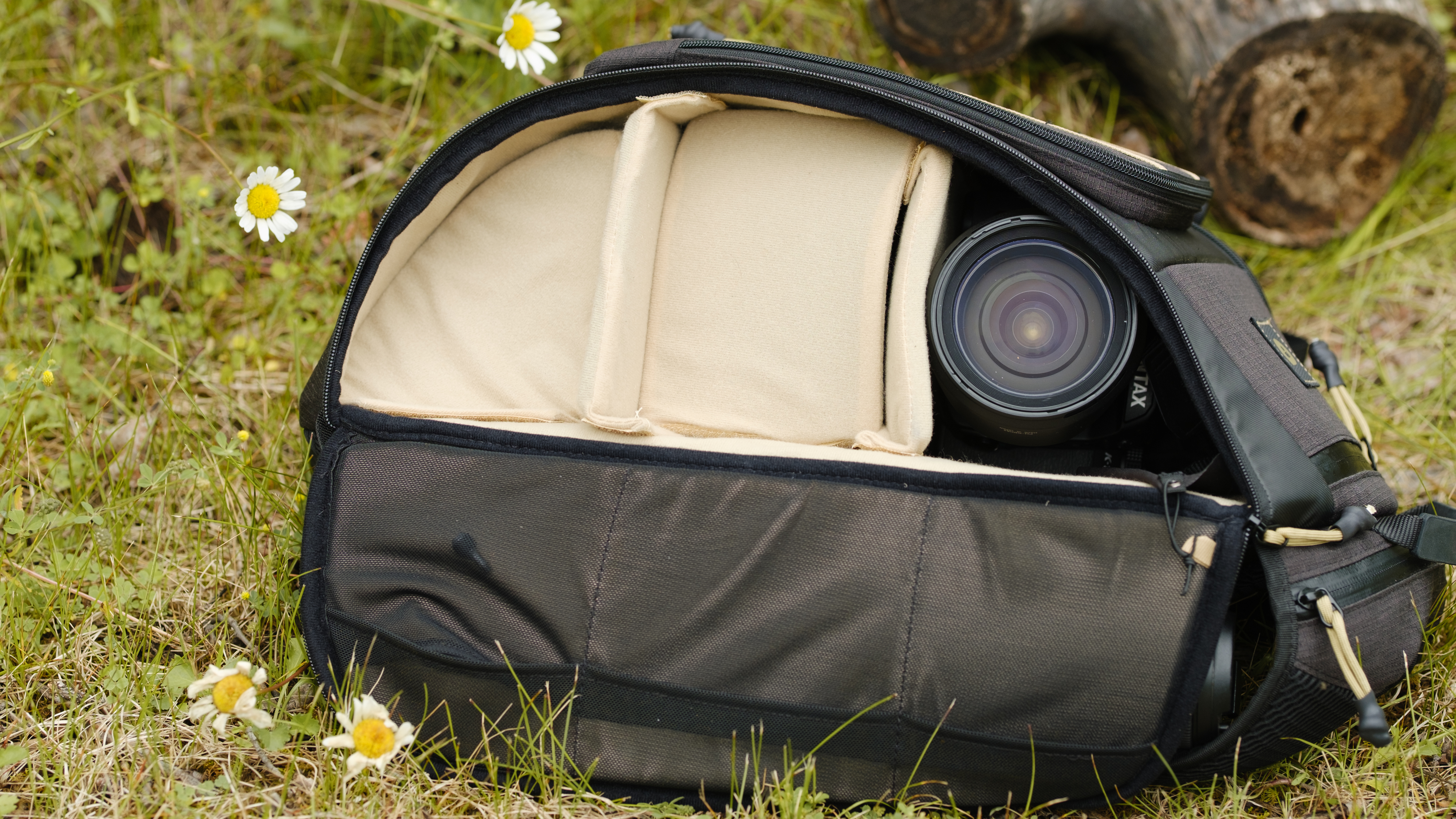 The PolarPro RoadRunner 16L camera backpack outside with wildflowers