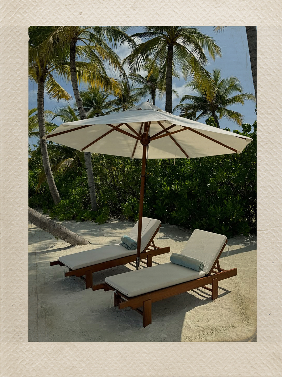 A beach recliner photographed by Emma Leger at Kagi Maldives Resort & Spa