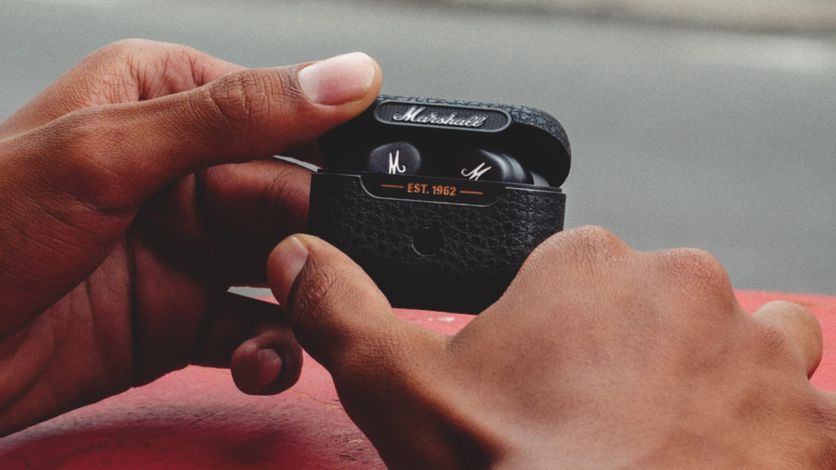 the marshall motif ANC true wireless earbuds in their charging case