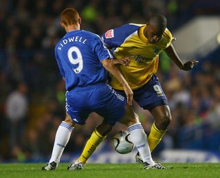 Steve Sidwell of Chelsea of Chelsea tackles Carl Cort of Leicester City during the Carling Cup Fourth Round match between Chelsea and Leicester City at Stamford Bridge on October 31, 2007 in London, England.