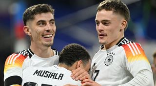 LYON, FRANCE - MARCH 23: Kai Havertz (L) of Germany celebrates after scoring with his teammates during the international friendly football match between France and Germany at Groupama Stadium in Decines-Charpieu, near Lyon, France on March 23, 2024. (Photo by Mustafa Yalcin/Anadolu via Getty Images)