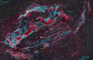 a colorful cloud of pink and green gas in space